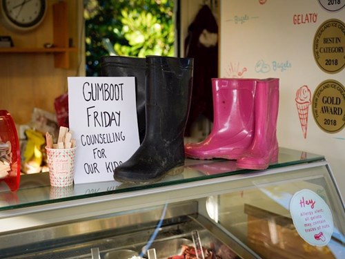 Colouful gumboots on a counter