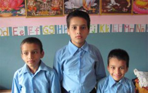 three children at a nepalese orphanage.